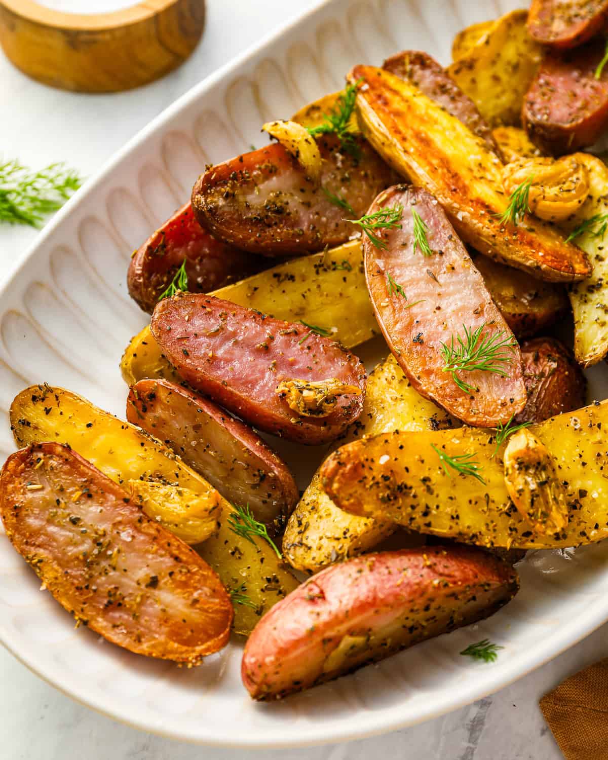 fingerling potatoes on a white serving platter.