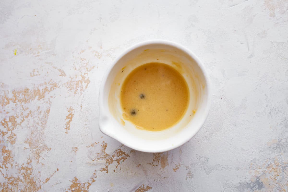 lemon pepper sauce roux in a white bowl.