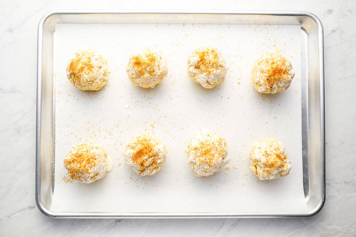 8 biscuits on a baking sheet.