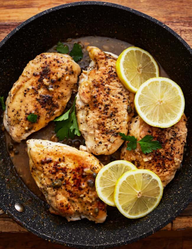 lemon pepper chicken in a pan.