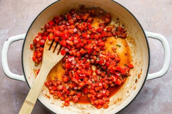 Tomatoes cooking in a pot.