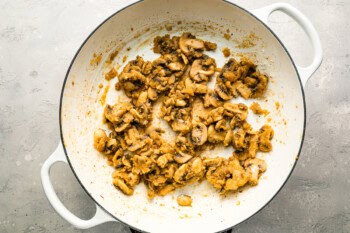 Mushrooms cooking in a pot.