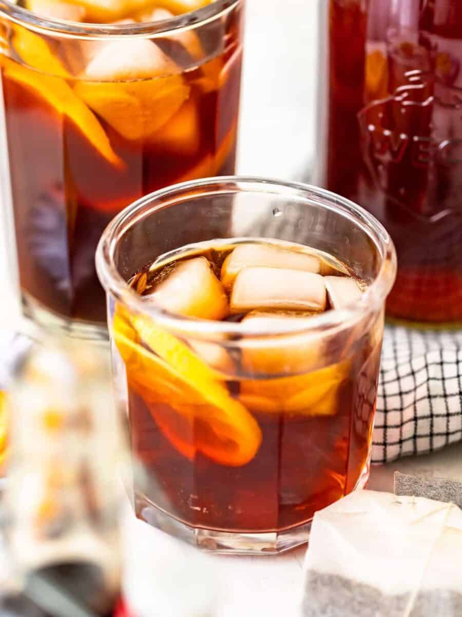 Homemade sweet tea garnished with a slice of orange.