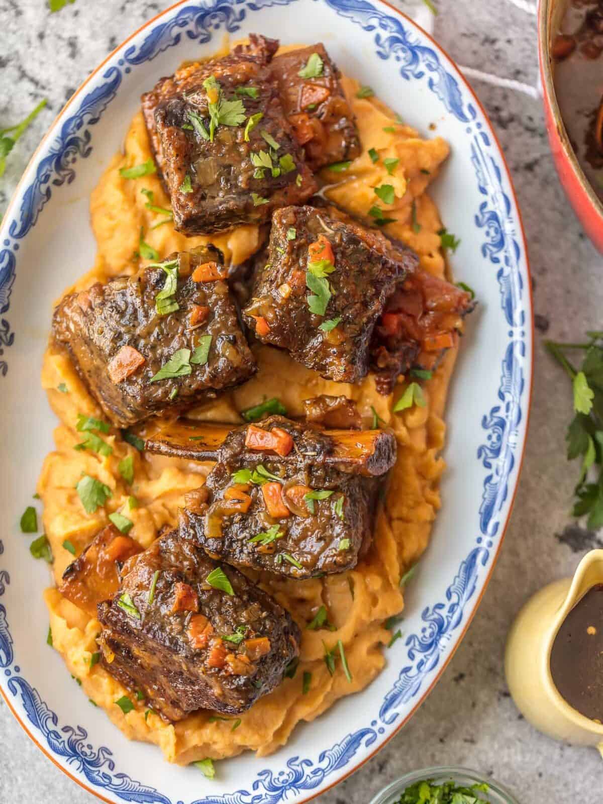 We love these DUTCH OVEN HONEY BOURBON SHORT RIBS! It's so easy to make these flavorful and fall off the bone ribs right in your dutch oven. Less cleanup and more flavor!