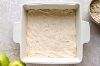 pie crust pressed into a square baking dish.