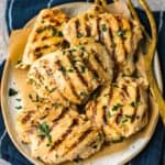 grilled yogurt marinated chicken thighs on platter