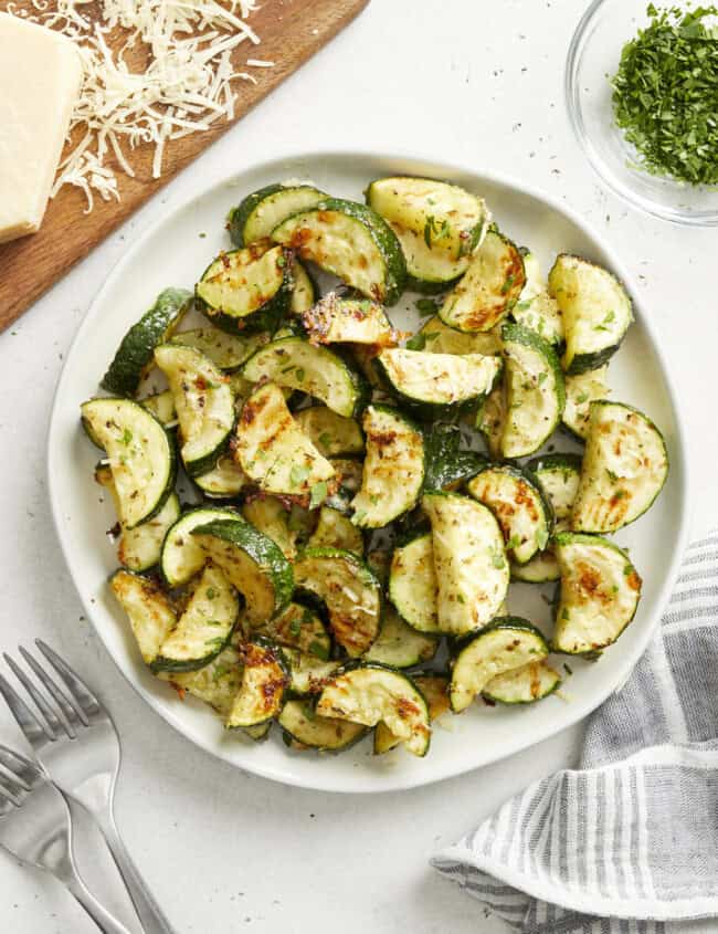 roasted zucchini on a white plate.