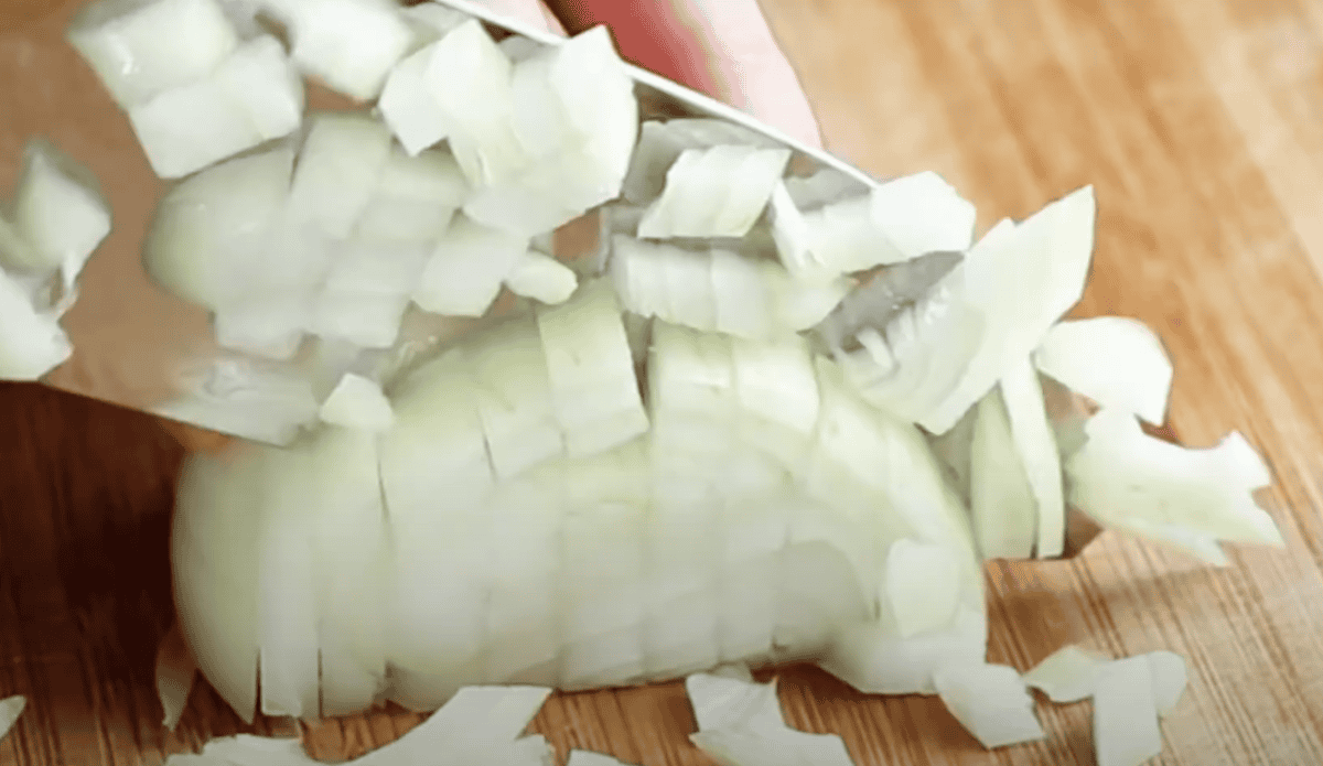 Mincing an onion.