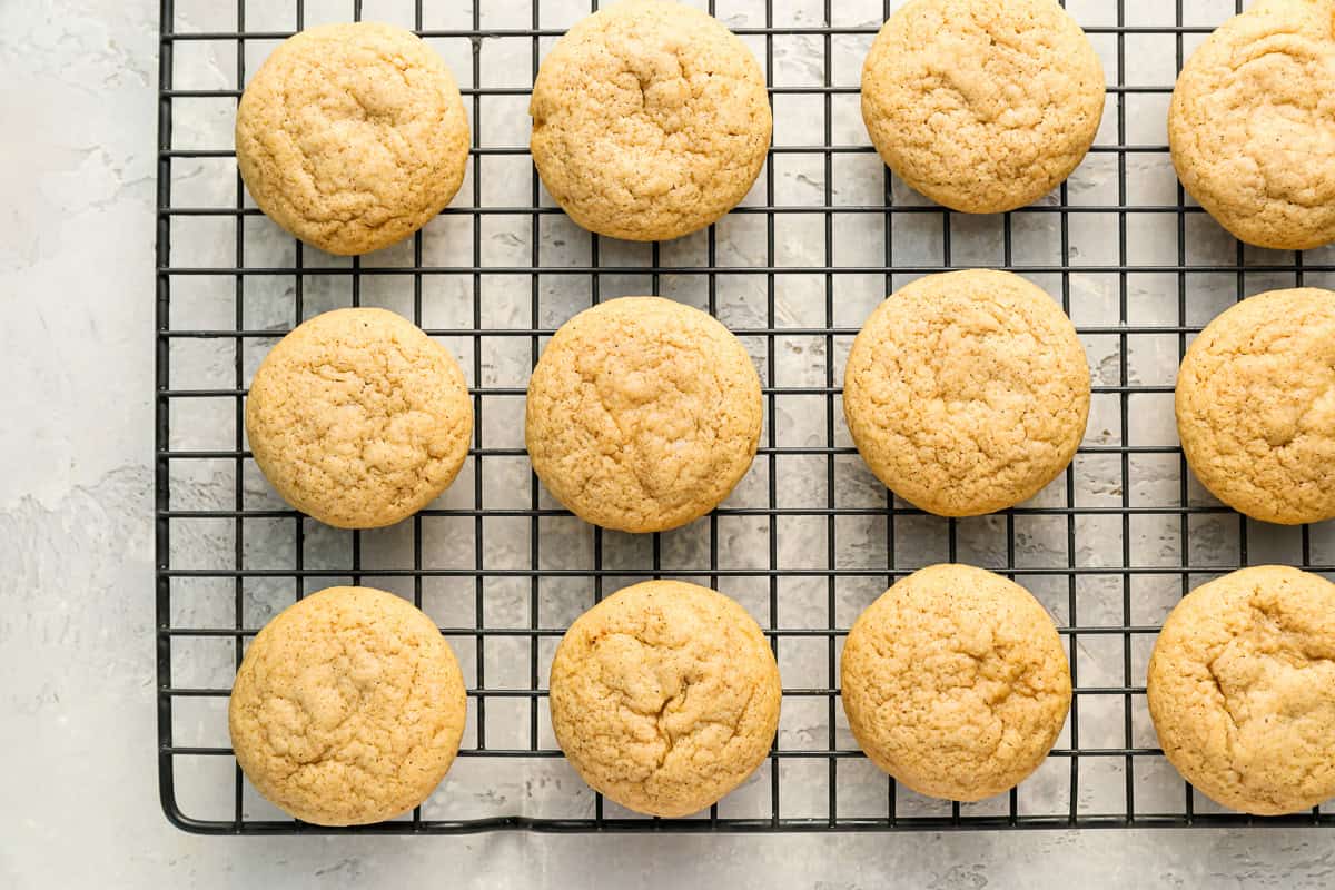 baked apple cider cookies on a wire rack.