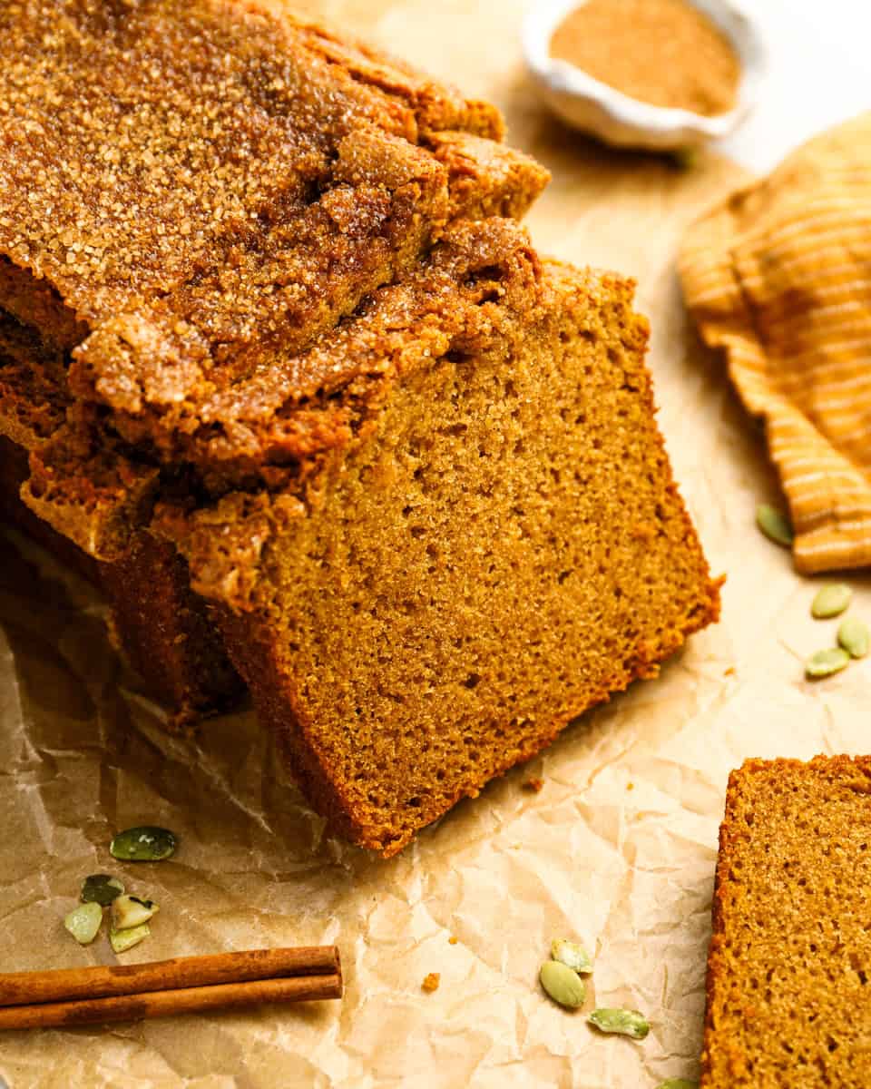 a partially sliced loaf of pumpkin bread.